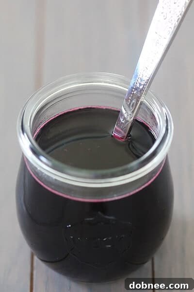 A vibrant glass of blueberry milk, showcasing its inviting color and freshness, ready to be enjoyed.