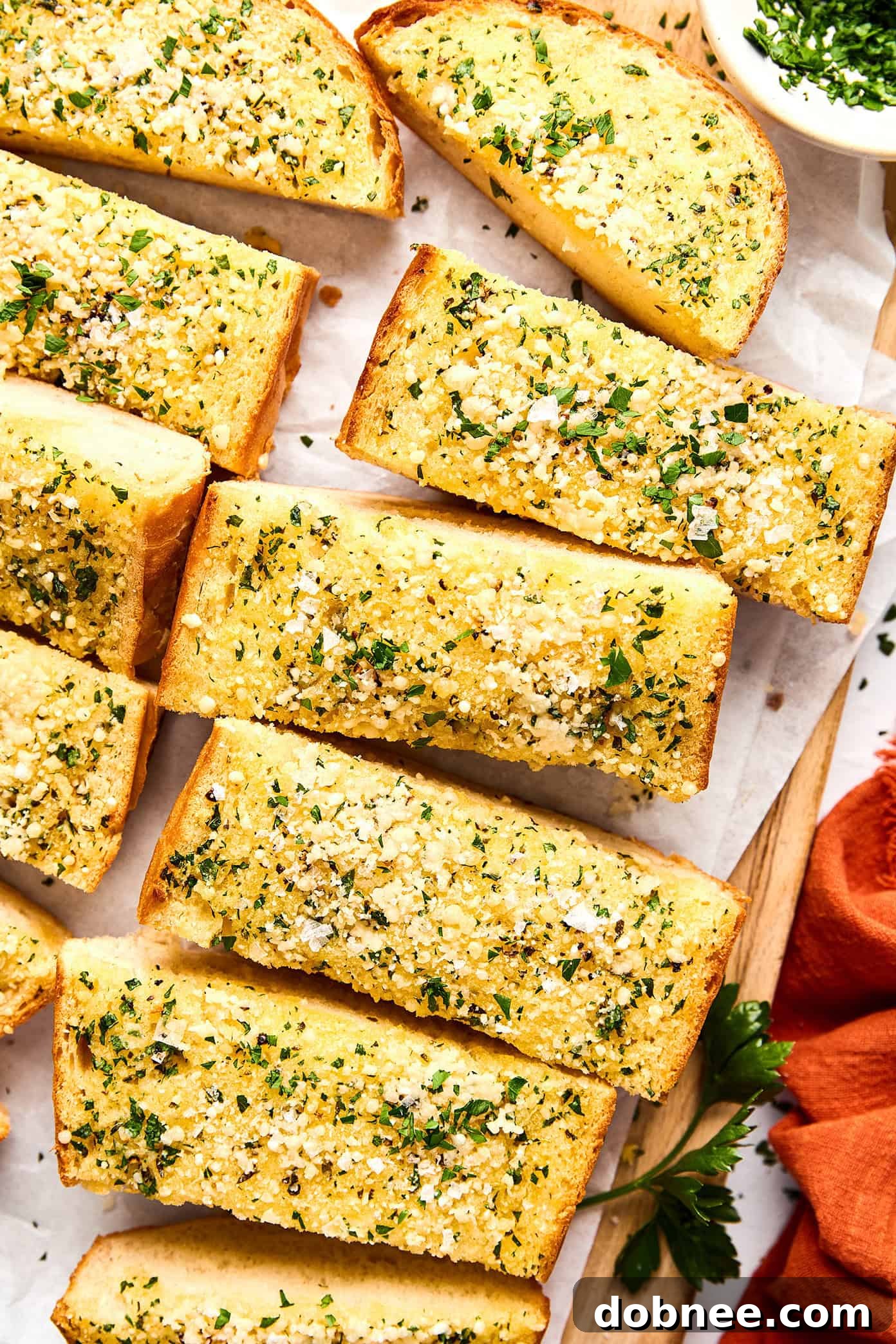 Freshly baked homemade garlic bread on a baking sheet.