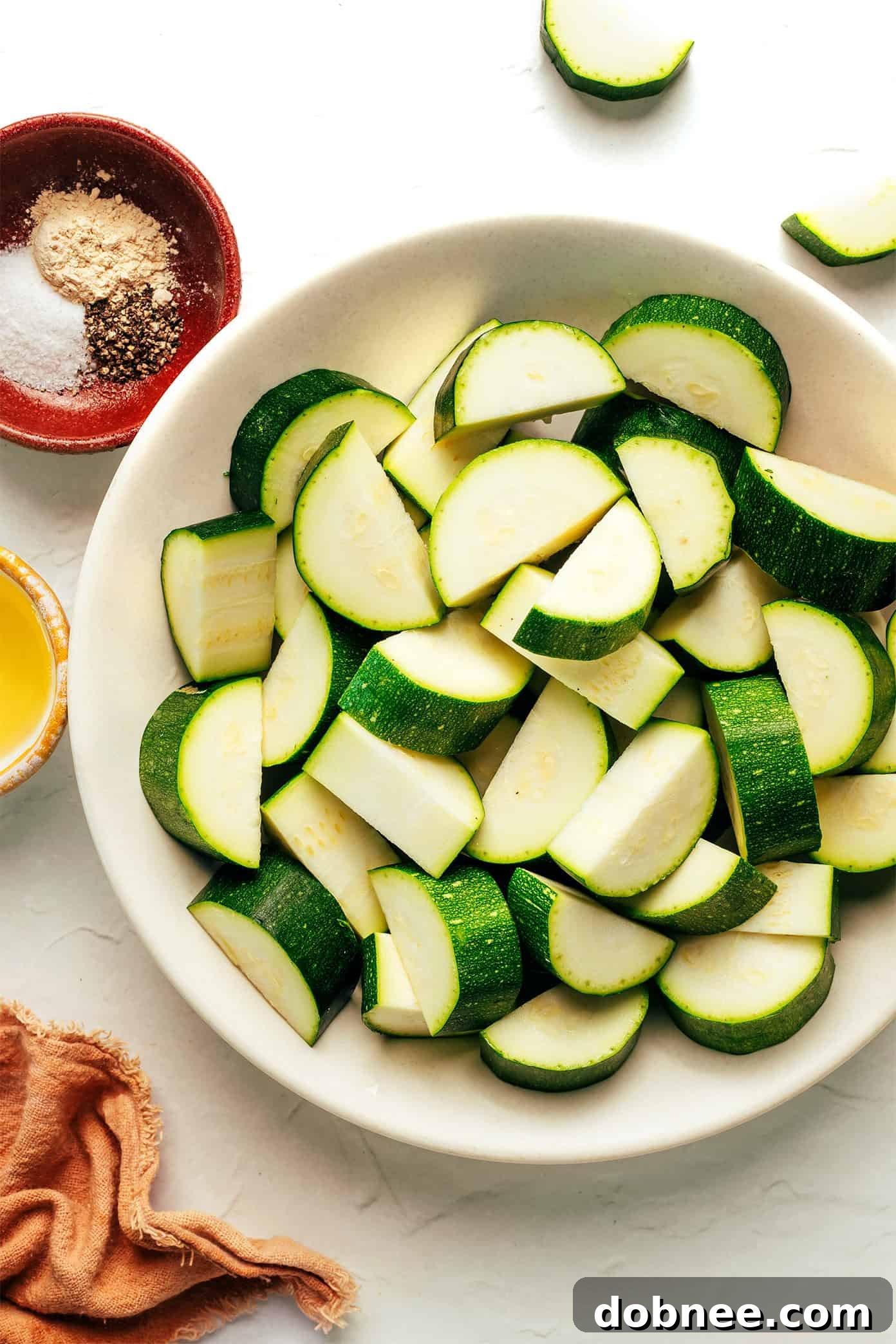Close-up of perfectly air-fried zucchini slices, golden and tender