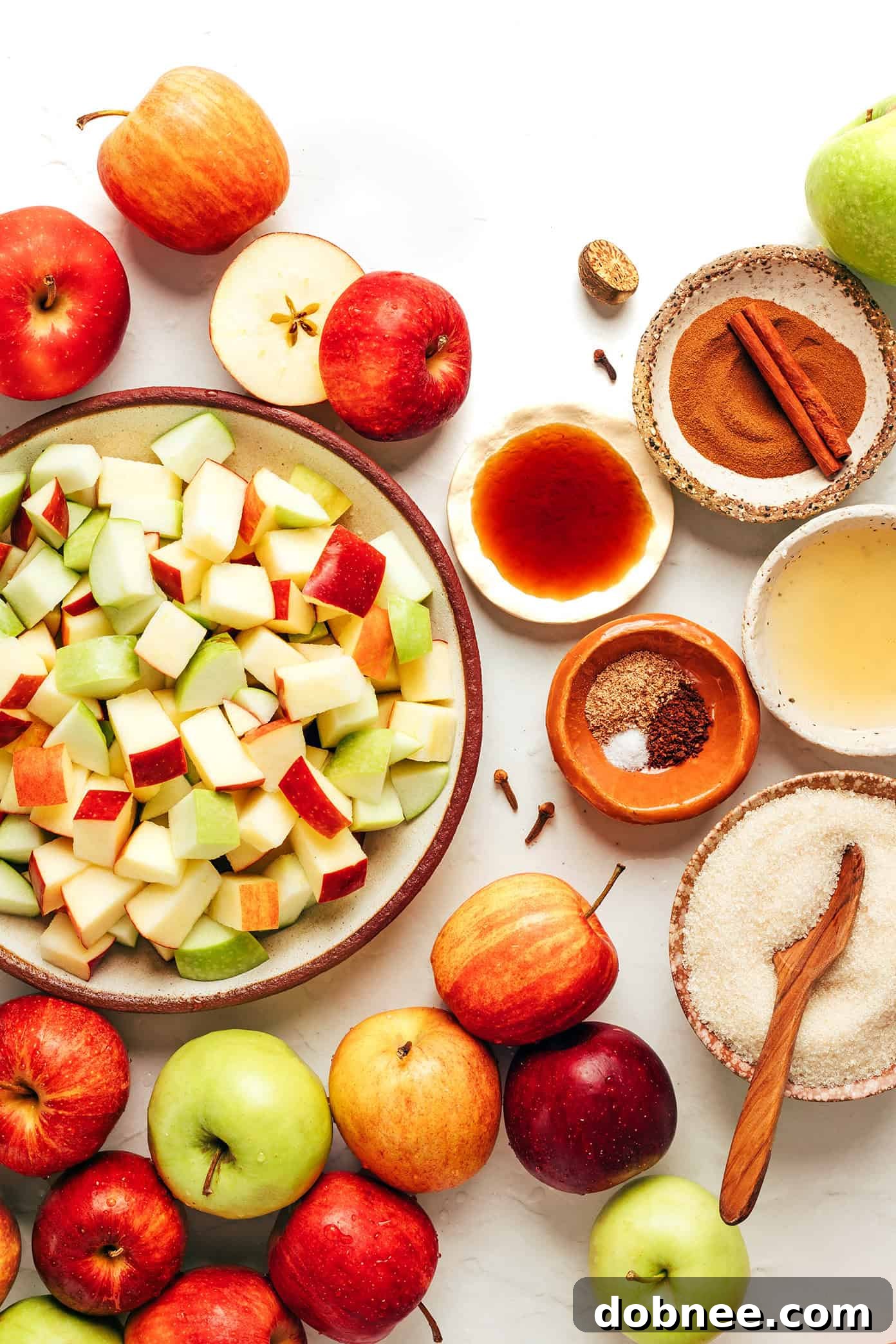A close-up shot of creamy apple butter in a jar, with wooden spoon.