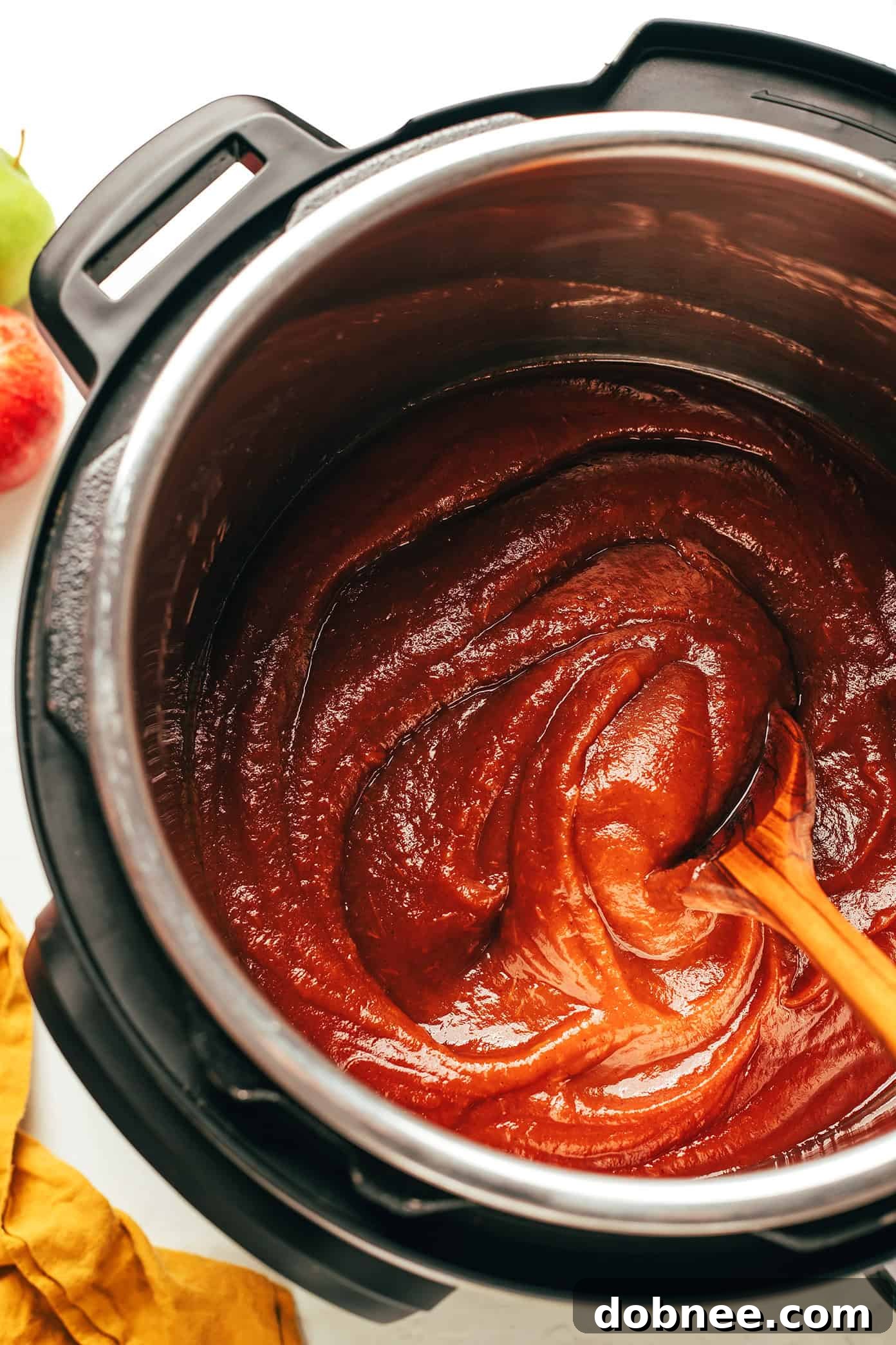 Homemade apple butter served with toast and a cup of coffee.