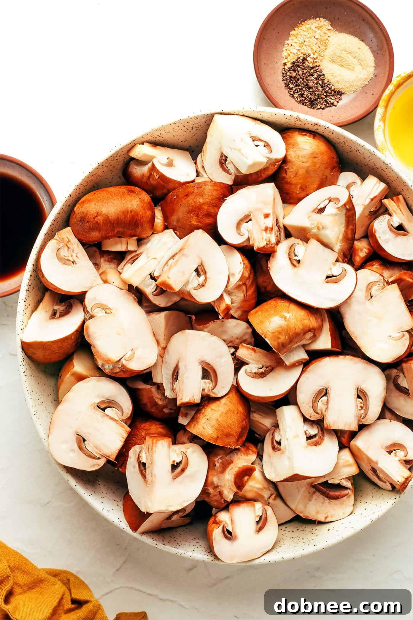 A bowl of freshly cooked air fryer mushrooms ready to be served.