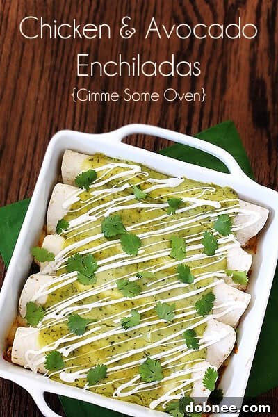A close-up shot of the freshly baked Chicken & Avocado Enchiladas, highlighting the golden-brown tortillas and creamy sauce.