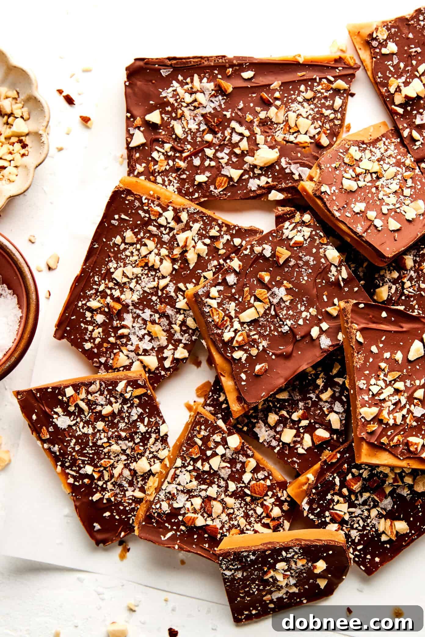 Deliciously crisp homemade toffee topped with melted chocolate and flaky sea salt.