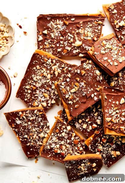 A stunning shot of homemade toffee with melted chocolate and almonds.