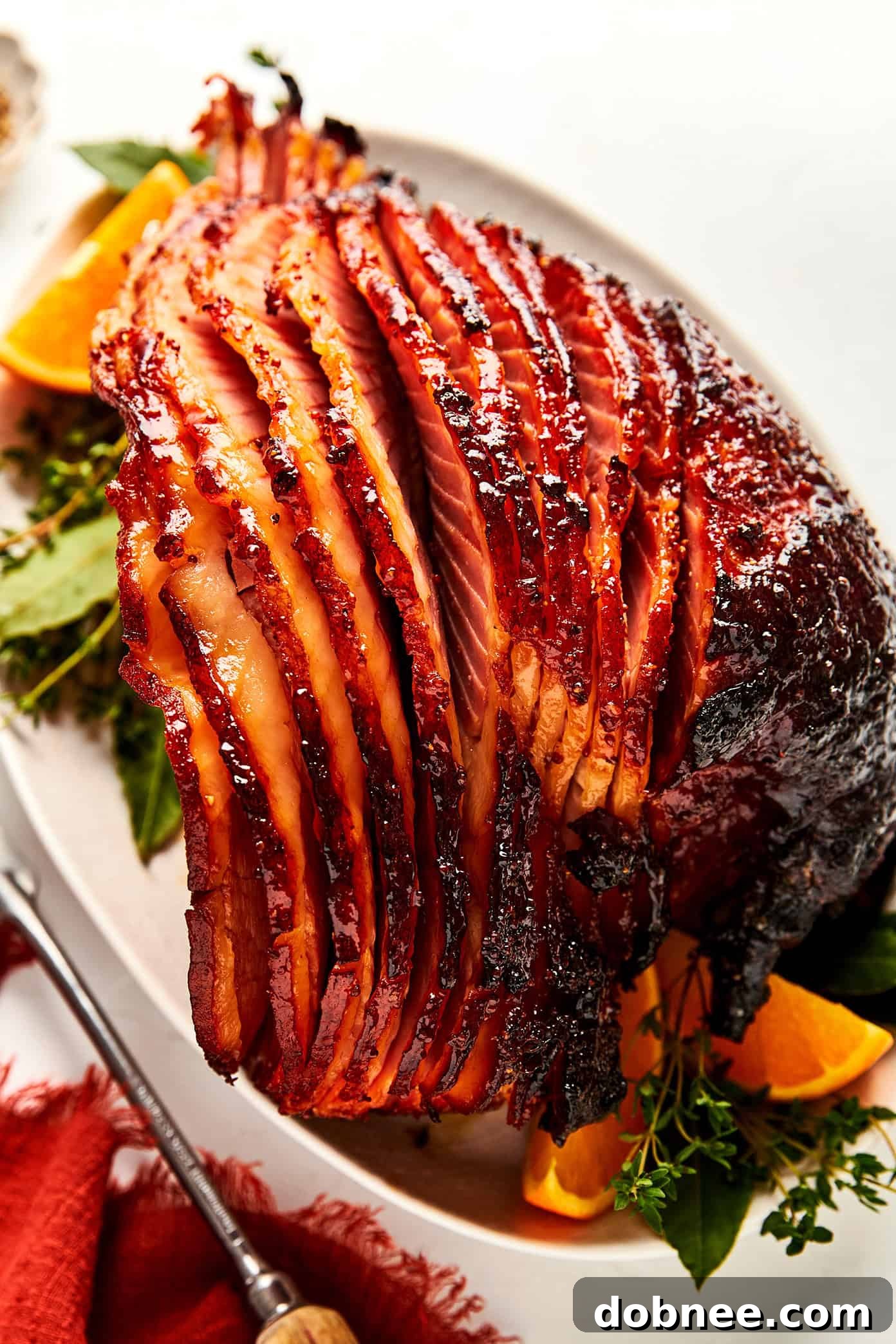 Perfectly honey glazed spiral ham, ready to be carved and served