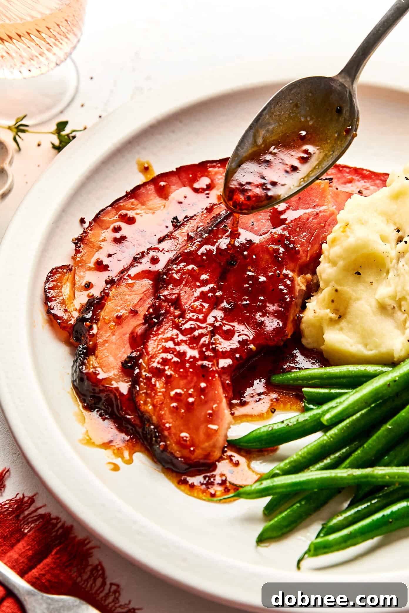 A festive glazed ham dinner, served with delicious side dishes