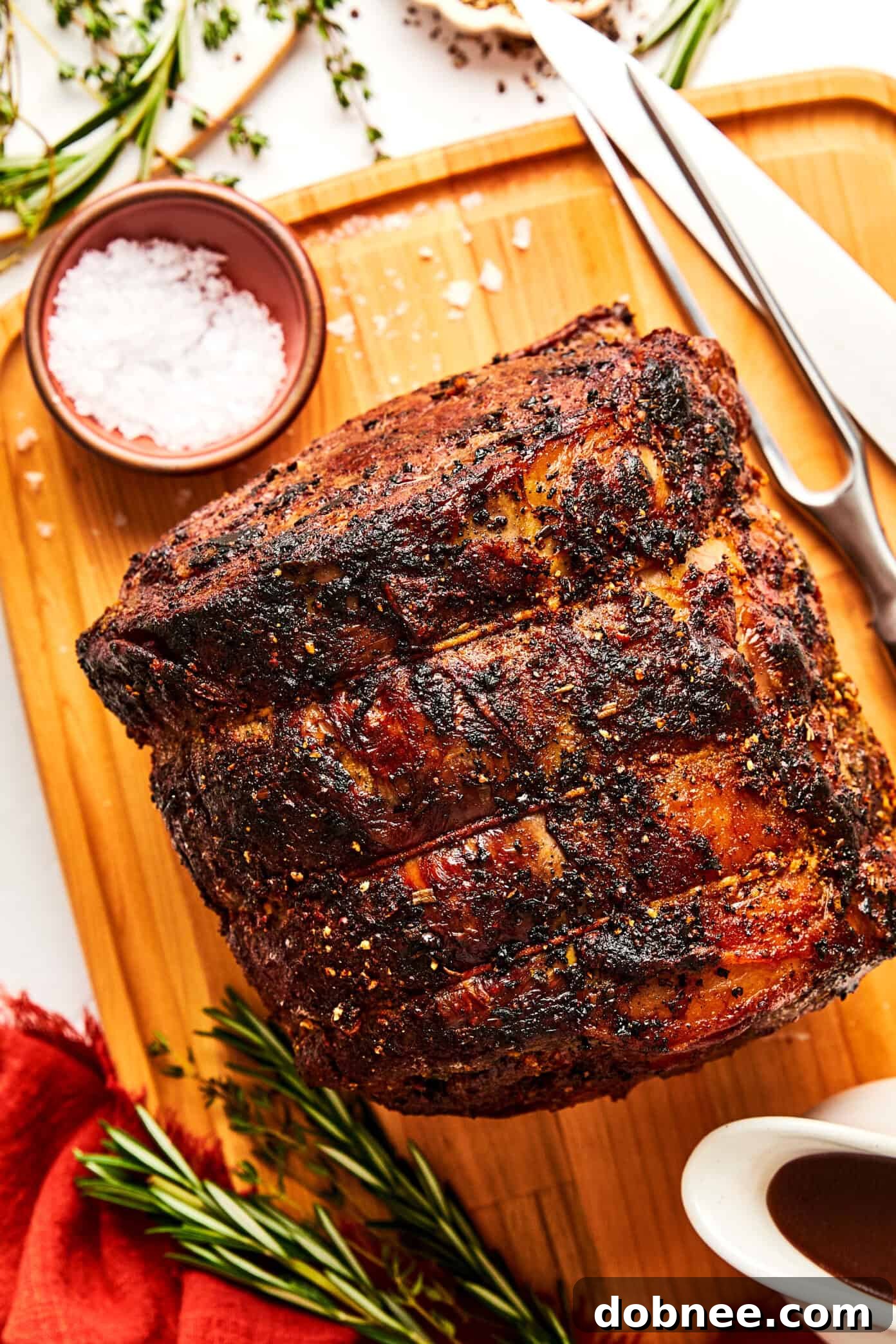A vibrant selection of fresh herbs and spices, including rosemary, thyme, garlic, and paprika, ready to be prepared for the prime rib butter.