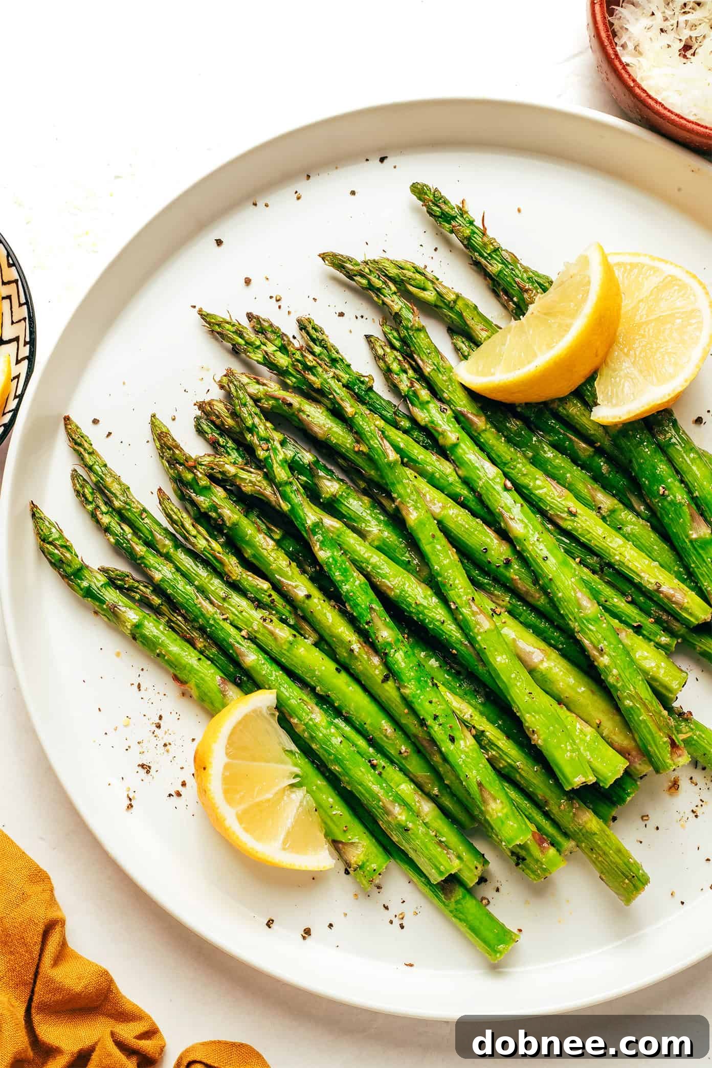 Freshly cooked air fryer asparagus on a plate