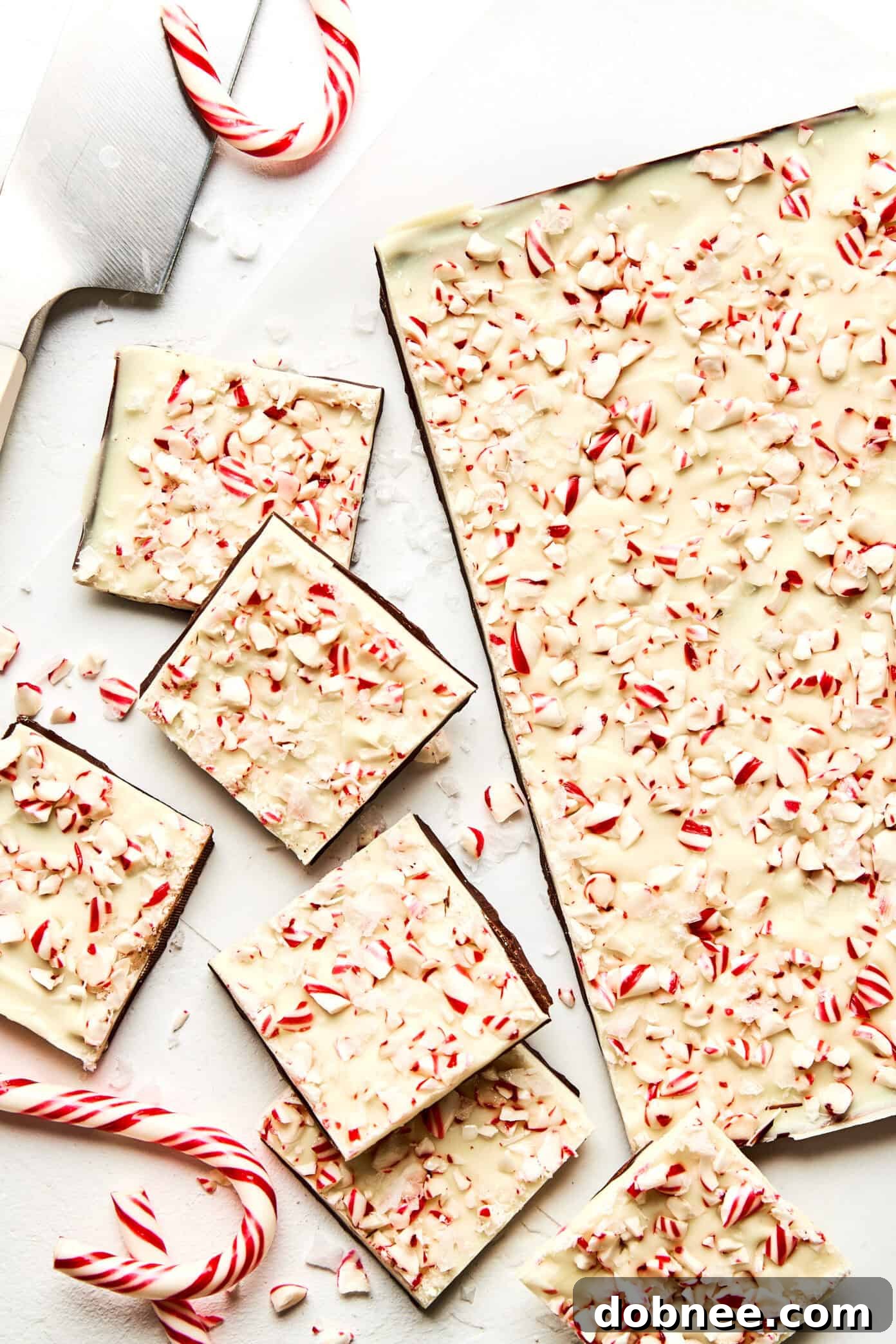 Festive Mint Chocolate Crunch 6 Pieces of peppermint bark displayed on a tray.