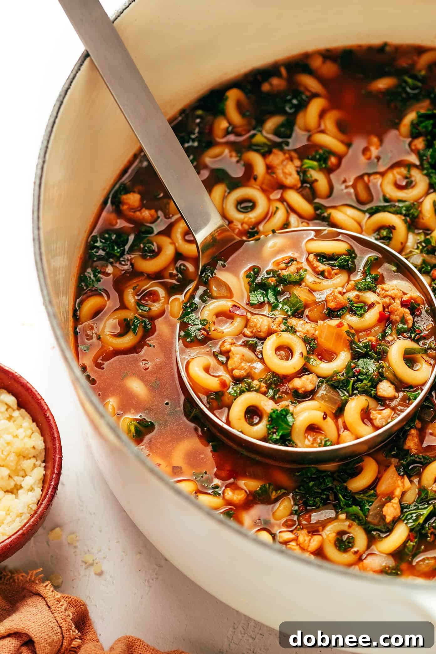 Overhead shot of a full bowl of Spaghettios and Sausage Soup, perfectly plated for a cozy meal.