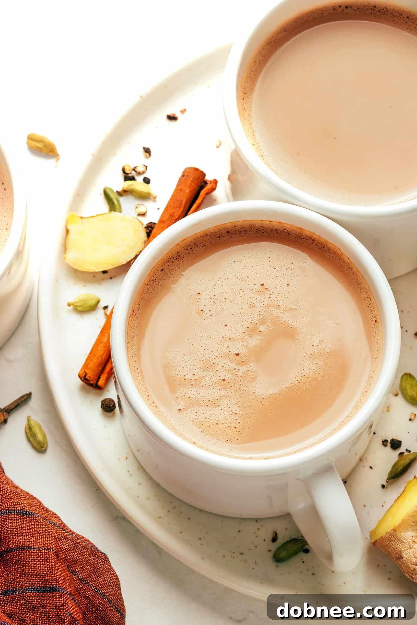 Two mugs of freshly made Masala Chai, ready to be enjoyed