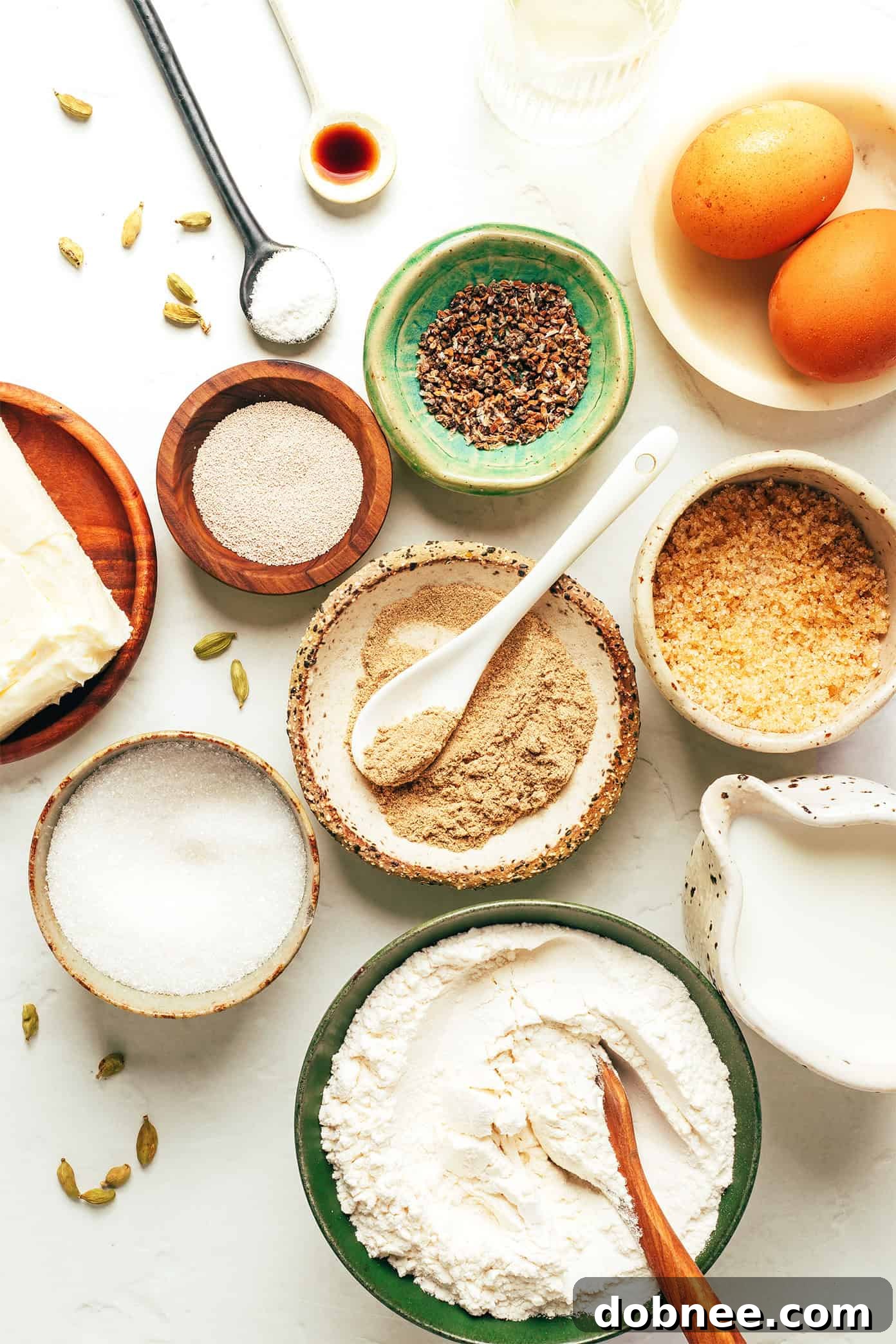 A close-up shot of the raw dough being twisted into intricate knots, showcasing the cardamom filling.