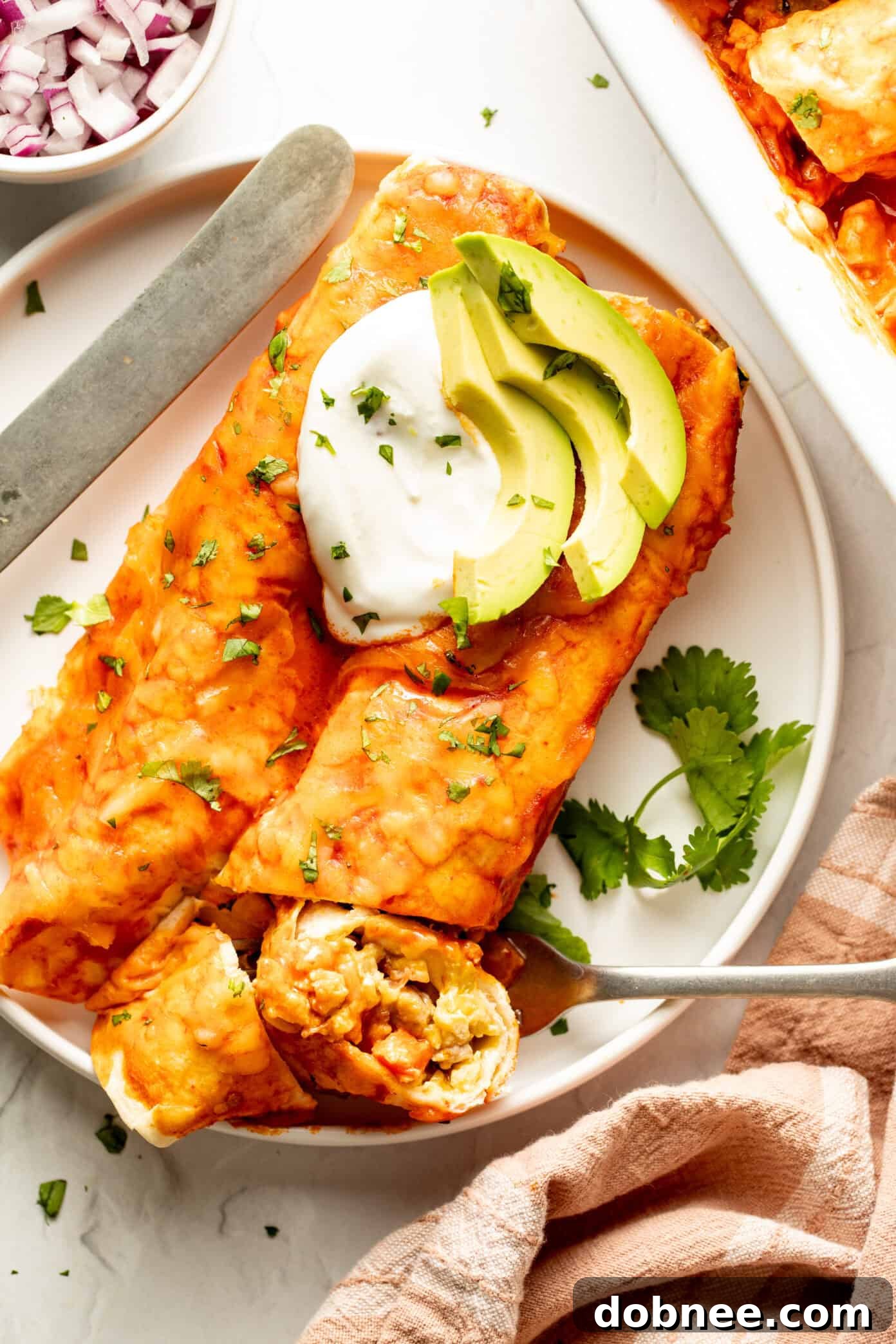 Close-up of baked breakfast enchiladas in a dish