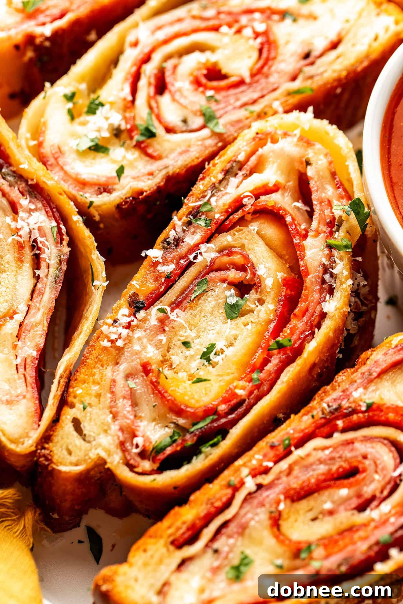 A close-up view of the golden, crispy crust of a baked Stromboli