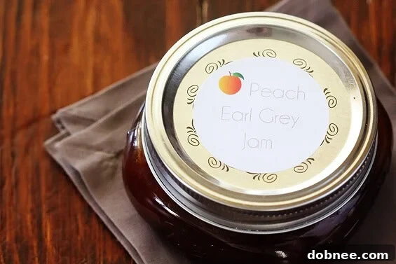 Jars of Peach Earl Grey Jam on a rustic wooden surface