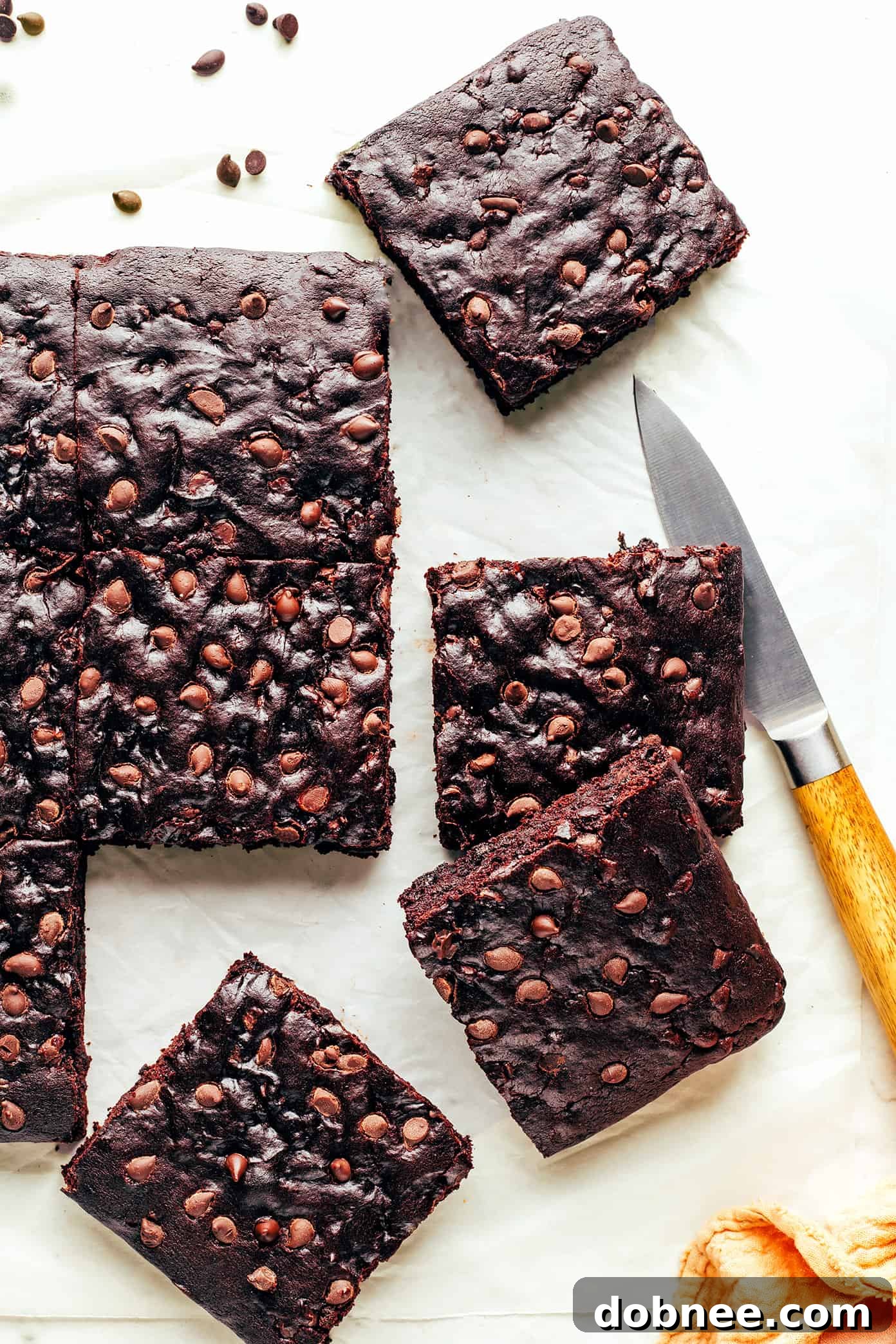 Decadent Plant-Based Brownies 5 Individual squares of vegan brownies, perfectly cut and stacked, ready to be served.