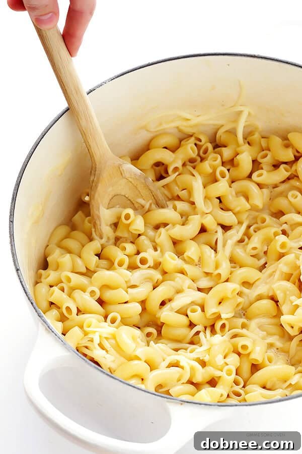 Fresh vegetables seasoned with olive oil, salt, and pepper, ready for roasting.