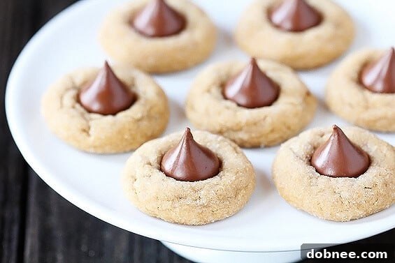 Delicious Biscoff Blossoms with Hershey's Kisses, a delightful twist on a classic cookie recipe.