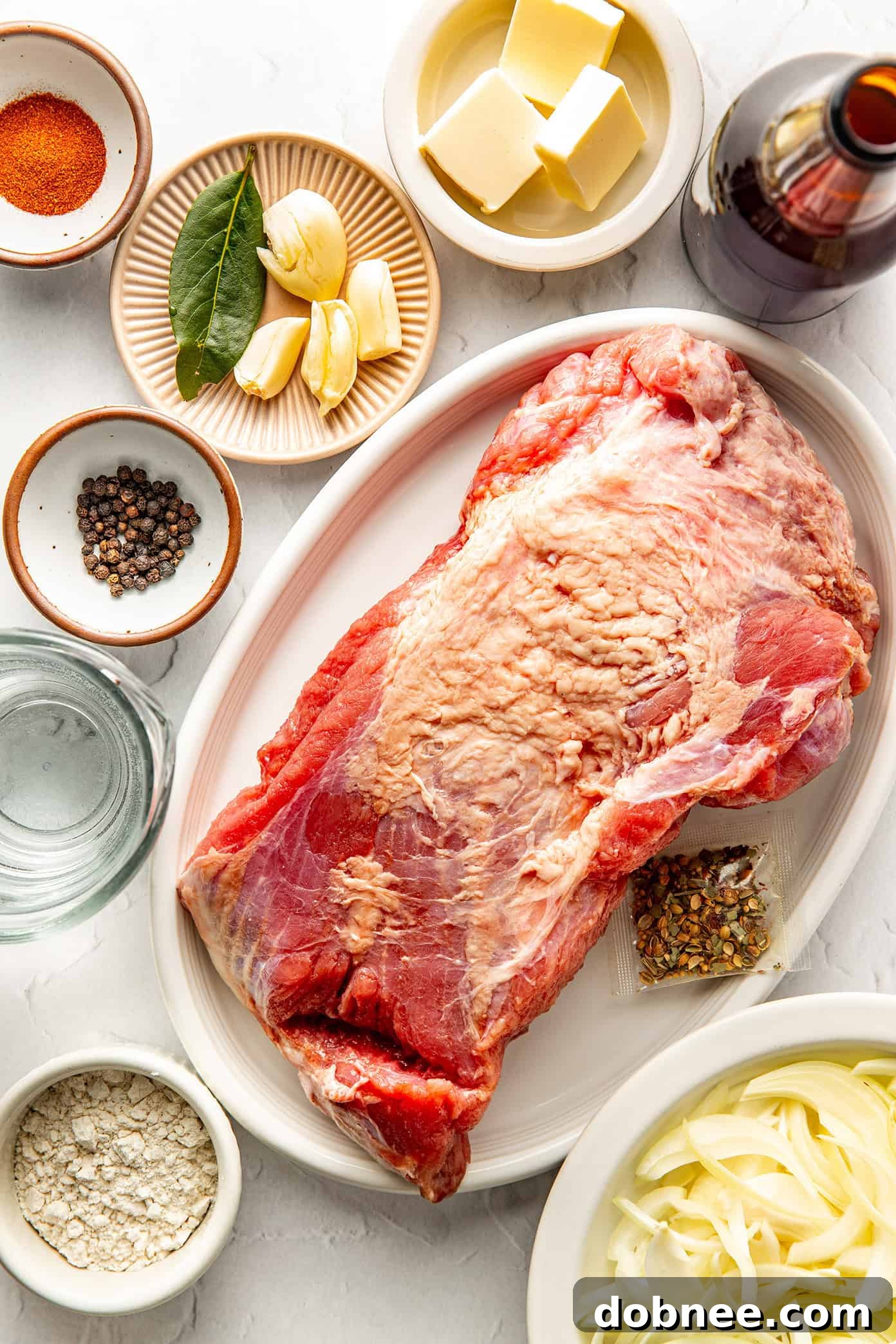 Crispy corned beef served on a platter with fresh herbs.