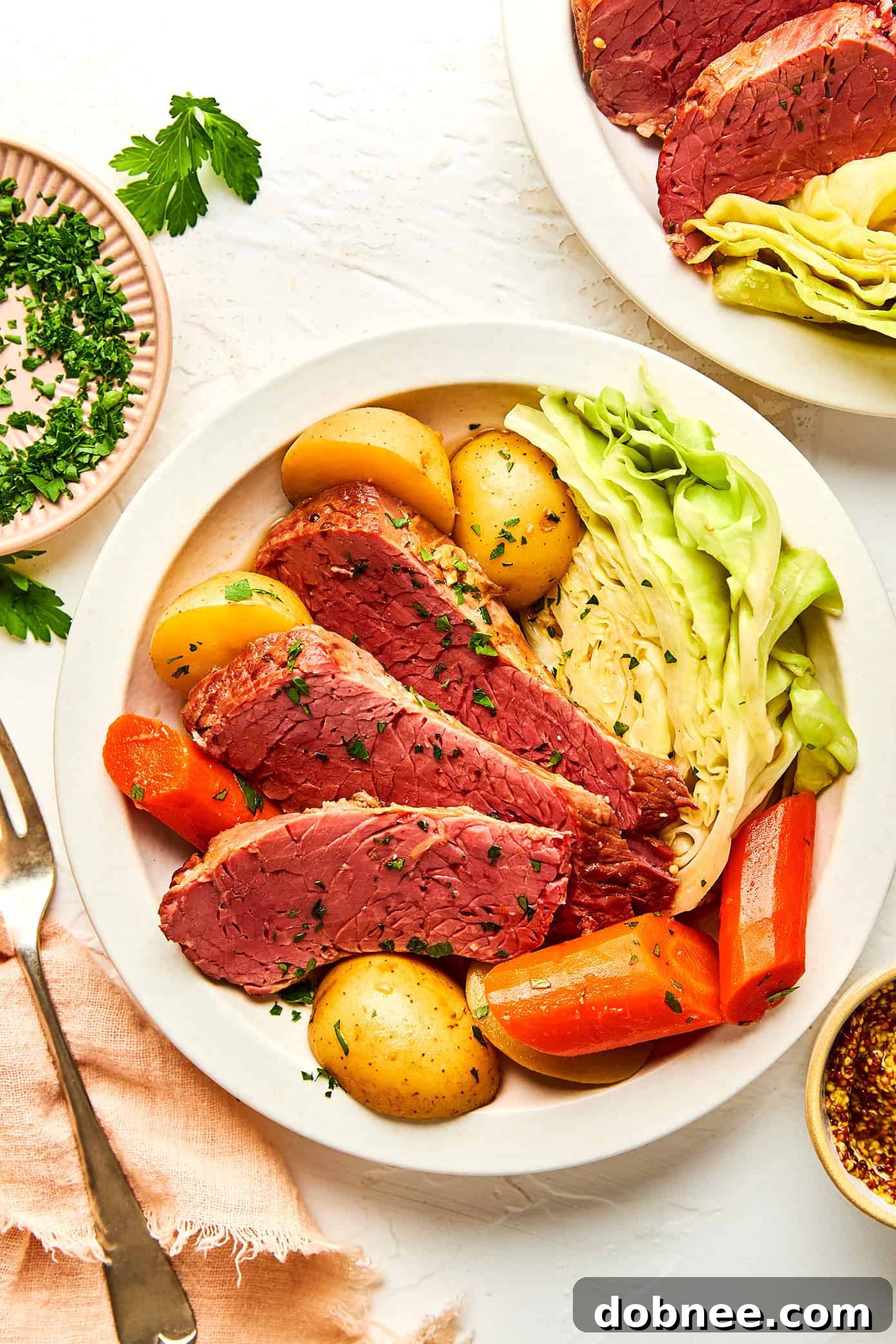 A serving of corned beef and cabbage on a plate.