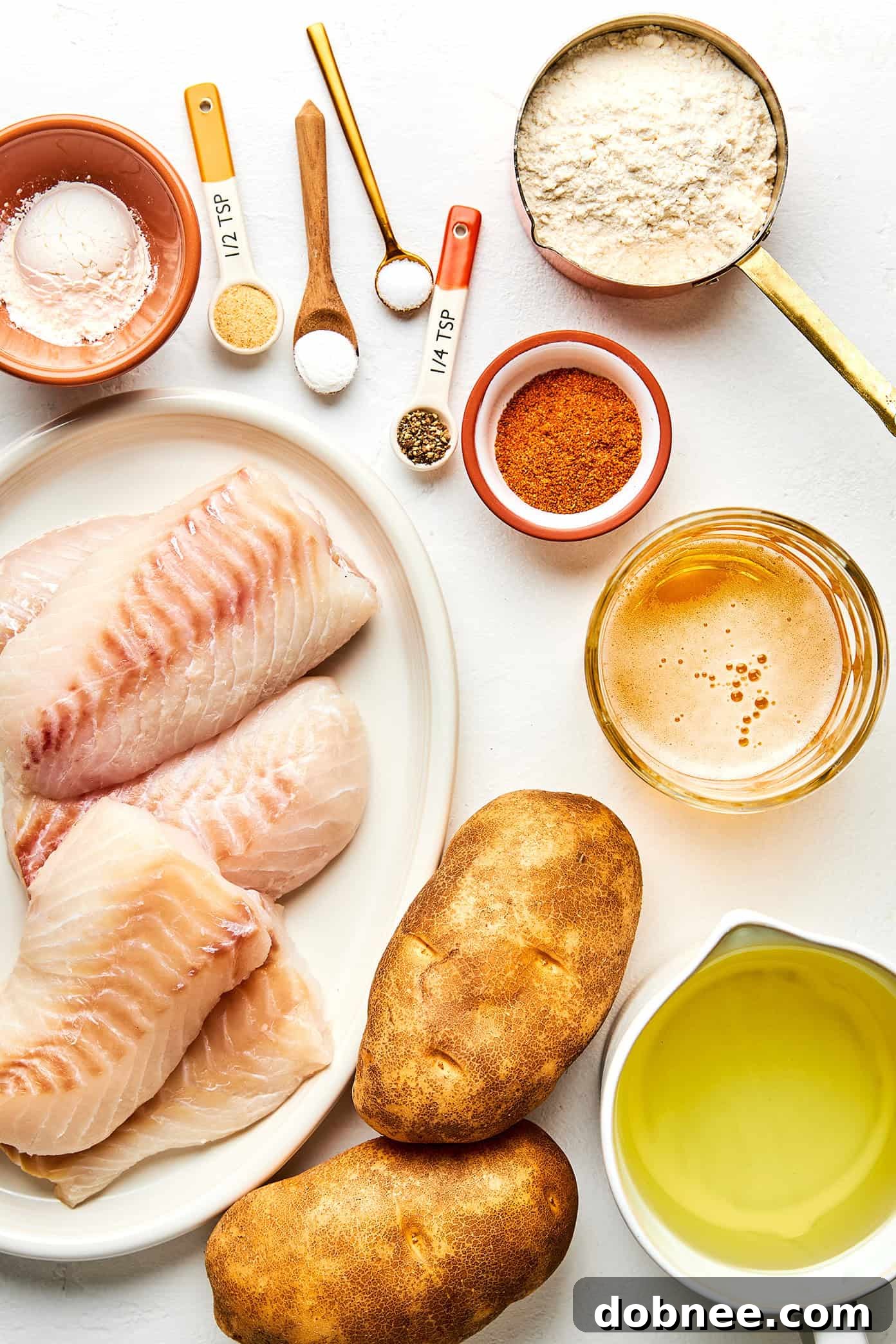 Freshly fried fish and chips arranged on a platter