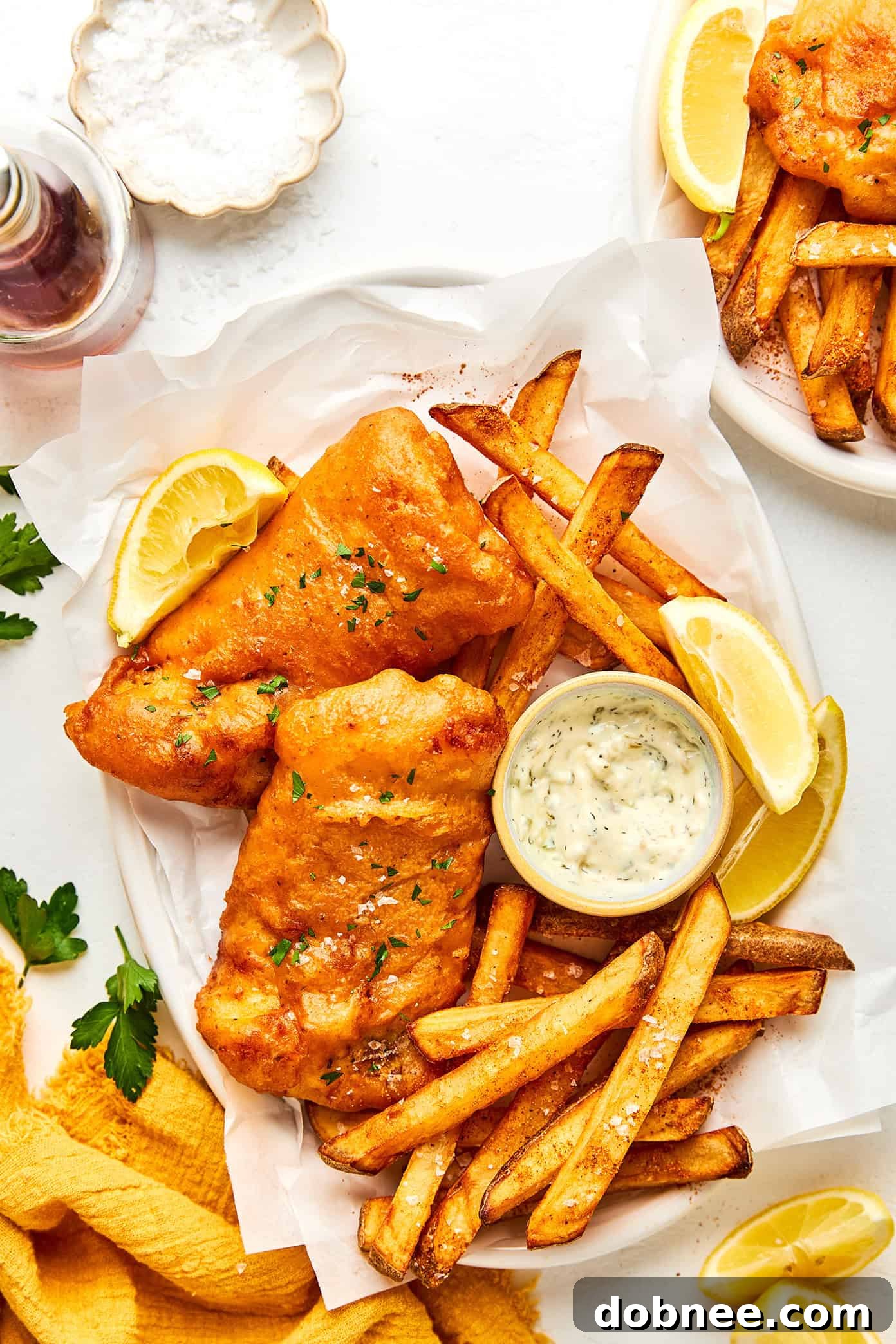 Delicious fish and chips with lemon and sauce