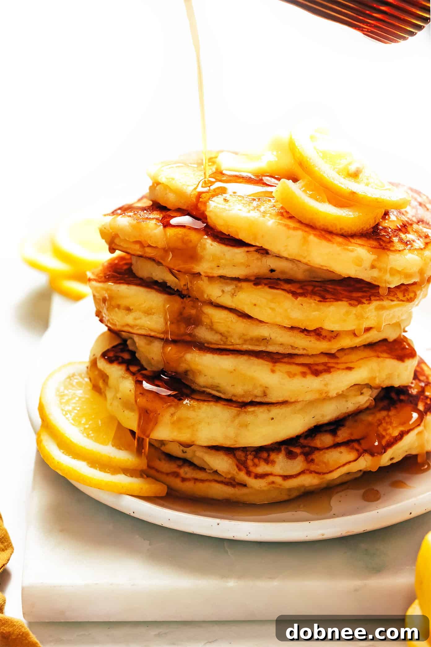 A final, beautiful stack of lemon ricotta pancakes, ready to be served.